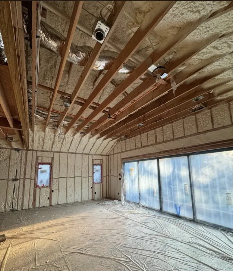 Interior walls and ceiling insulated with spray foam during new construction in Dixon